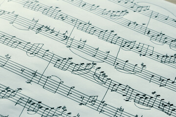 Music notes macro background, handwritten notes, selective focus