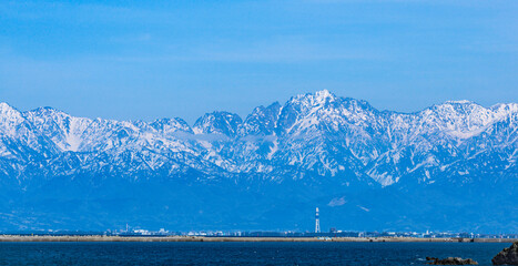 Tateyama mountain range over the sea. in Toyama, Japan 海越しに見える立山連峰 富山県