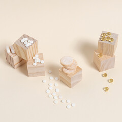 stack of pills arranged on wooden cubes