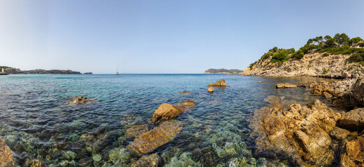  Beautiful panoramic view of the seacoast of Majorca with an amazing turquoise sea,. Concept of summer, travel, relax, hotel, holiday and enjoy	