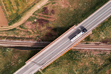 Aerial view of cistern truck on railroad overpass bridge