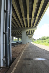 flyover seen from below, looking at the concrete construction