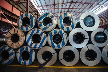 Rolls of galvanized steel sheet inside the factory warehouse