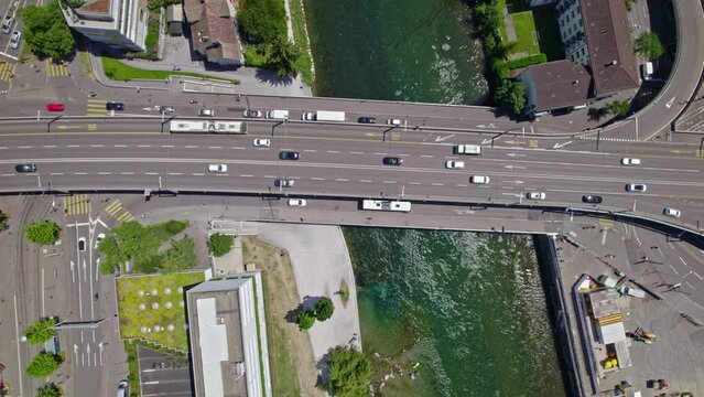 Aerial view of Escher Wyss Square with highway junctions and Limmat River at industrial district of City of Z&uuml;rich on a sunny summer day. Movie shot June 20th, 2022, Zurich, Switzerland.