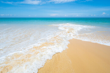 Fototapeta na wymiar Amazing tropical beach sea water wave on sand beach in sunny day Location Phuket Thailand on may 2022