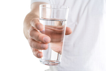 Close up image of man holding glass of water