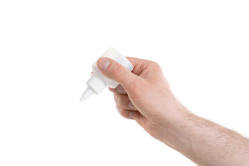 Man's hand holding a white bottle of glue trying to fix something