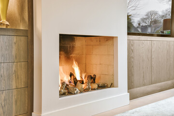 Fire burning in modern fireplace