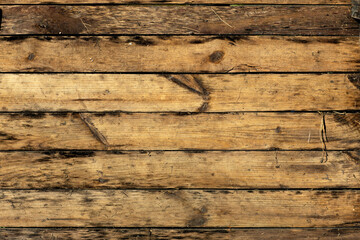 old brown boards shield grass