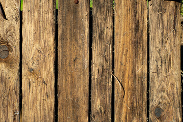 old brown boards shield grass