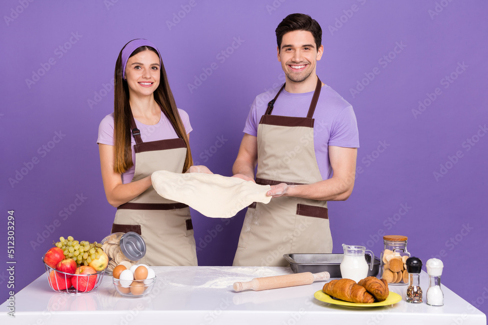 Sticker portrait of cheerful satisfied people hold pizza dough look camera isolated on purple color backgrou