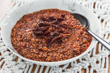 healthy plant-based food, vegan quinoa with tomato sauce and sundried tomatoes