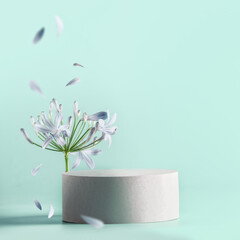 Beautiful minimal  modern product display with podium with flower bloom with flying petals at pale blue background. Place for beauty products or marketing campagne. Front view.