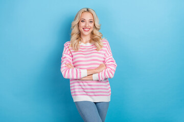 Photo of funny adorable woman wear striped sweater smiling arms crossed isolated blue color background