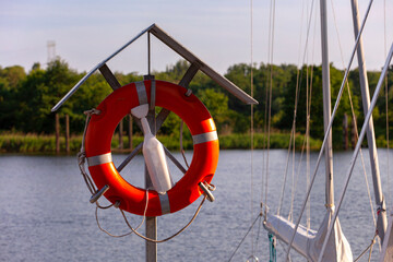  Lifebuoy float in port. Emergency rescue equipment, life ring, lifebelt, life preserver, at...