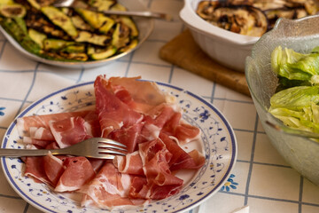 Italian ham served on plate, prosciutto crudo