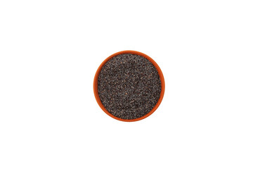 Blue poppy seeds in ceramic bowl isolated on white background, top view. Delicious Food ingredient, used in culinary