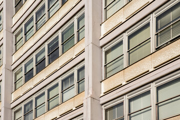 Fototapeta premium Facade of a building with many windows. The building is for office use.