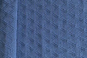 Hand knitted blue merino baby blanket texture, brocade knitting pattern background
