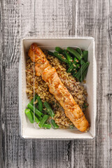 Healthy food to go. Quinoa with chicken meat in takeaway container