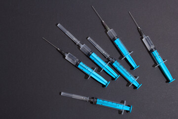 Naklejka premium Disposable plastic syringe prepared for injection and vaccination in the hospital. The concept of medicine and health