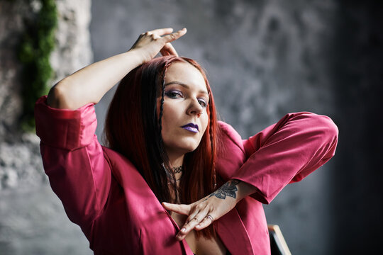 Closeup portrait of extravagant young woman dancing vogue with focus on hand movements