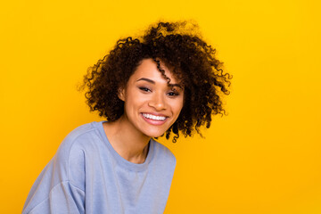 Photo of adorable positive lady toothy beaming smile look camera isolated on vibrant yellow color background