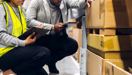Fototapeta na wymiar Portrait two african american engineer team shipping order detail on tablet check goods and supplies on shelves with goods inventory in factory warehouse.logistic industry and business export