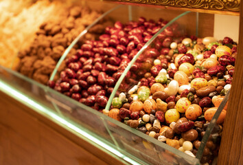 Turkish beautiful colorful delights,nuts in chocolate,dried fruits.Sweet food background.Copyspace