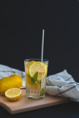 Ingredients for lemonade on a dark background. Close-up of lemonade on a dark background. Ingredients for a refreshing drink. Citrus.