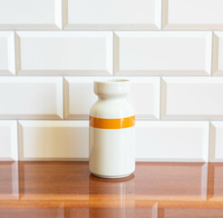 Vintage porcelain vase with orange stripe