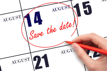 Hand drawing red line and writing the text Save the date on calendar date August 14.