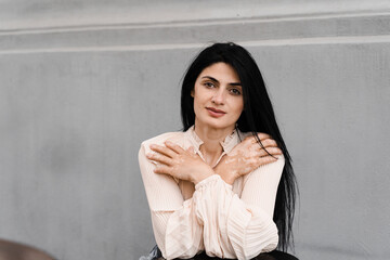 Fototapeta premium Attractive woman shows hands with spots of vitiligo pigmentation. Lifestyle with skin seasonal diseases.