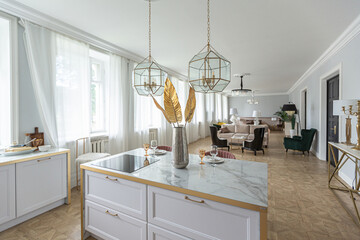 luxury interior of a modern apartment in bright colors with stylish furniture. kitchen, bedroom and living room area without walls.