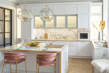 a close view of the white stylish kitchen with a cooking island in the luxurious interior of a modern apartment in light colors with stylish furniture.