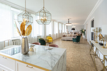 luxury interior of a modern apartment in bright colors with stylish furniture. kitchen, bedroom and living room area without walls.