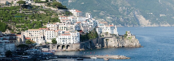 Stunning view of the village of Amalfi during a sunny day. Amalfi is a city and comune on the...