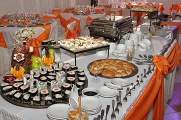 froid buffet table with canapes and savory snacks with meats fruits cheeses with decorations of...