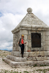 Female Adult Hiker Resting on the top of a Peski Mountain Surrounding  Plateau, location of the Austro-Hungarian Monument of WWI