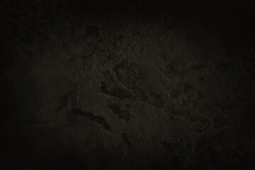 Dark brown slate stone wall texture in natural pattern with high resolution for background and design art work.