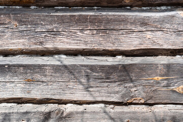 Wooden natural background, old paint on wooden fence surface. Vintage retro cracked wooden logs