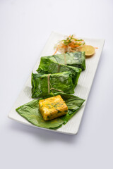 patrani paneer, a paneer marinated in sauce and barbecued and then covered in leaf