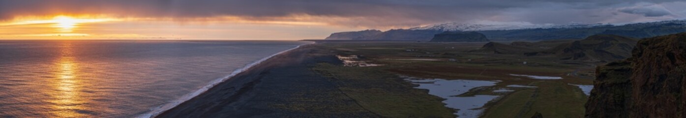 Picturesque autumn evening view to endless ocean  black volcanic sand beach from Dyrholaey Cape Viewpoint, Vik, South Iceland.