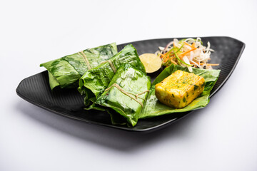 patrani paneer, a paneer marinated in sauce and barbecued and then covered in leaf
