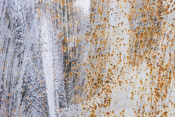 Old scratched and rusty painted metal surface, background texture. Texture of metal rusty wall