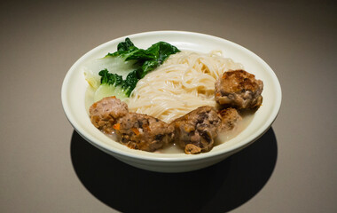 Asian Noodle Soup. Mee Sua in Soup with Handmade Meatballs and Green Vegetables. Asian Home Cooking.