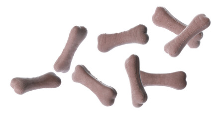 Bone shaped cookies for dogs falling on white background