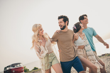 Photo of crazy carefree people cuddle walk coast enjoy bonding trip wear boho outfit nature seaside...