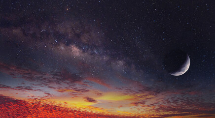 sunset sky with crescent moon and milky way stars