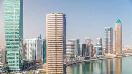 Fototapeta na wymiar Cityscape skyscrapers of Dubai Business Bay with water canal aerial timelapse.